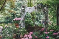 Small garden wedding decoration with hydrangea flowers and white backdrop fabric