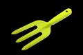 Small gardening , green fork isolated