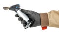 Small gas torch in worker palm in black protective glove and brown uniform isolated on white background Royalty Free Stock Photo