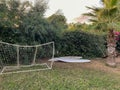 Small gates for playing mini-football on a green lawn against the backdrop of palm trees on vacation in a paradise warm eastern Royalty Free Stock Photo