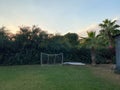 Small gates for playing mini-football on a green lawn against the backdrop of palm trees on vacation in a paradise warm eastern Royalty Free Stock Photo