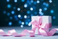 Small gift box or present with pink bow ribbon against magic bokeh background. Greeting card for Christmas, New Year or wedding. Royalty Free Stock Photo