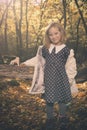 Small girl alone in wild forest in style of halloweeen witch Royalty Free Stock Photo