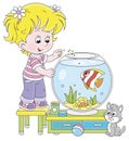 Small girl with an aquarium fish and a kitten Royalty Free Stock Photo