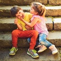 Small girl and boy on stairs. Relations. childhood first love. couple of little children. Boy and girl. summer holiday Royalty Free Stock Photo