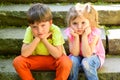 Small girl and boy on stairs. Relations. childhood love. couple of little children. Boy and girl. summer holiday and Royalty Free Stock Photo