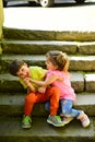 Small girl and boy on stairs. Relations. summer holiday and vacation. childhood first love. couple of little children Royalty Free Stock Photo