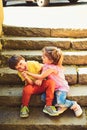 Small girl and boy on stairs. Relations. summer holiday and vacation. childhood first love. couple of little children Royalty Free Stock Photo