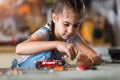 Small girl making a robot Royalty Free Stock Photo