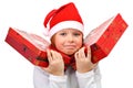 Small girl carrying two large presents isolated Royalty Free Stock Photo