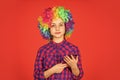 Small girl colorful wig use smartphone. positive and cheerful. childhood happiness. kid looking funny in rainbow wig Royalty Free Stock Photo