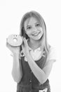 Small girl with donut isolated on white. Candyshop concept. Childhood and happiness. Happy child hold glazed ring