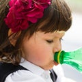 Small girl drinking water from bottle