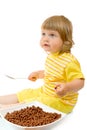 Small girl eat corn flakes Royalty Free Stock Photo