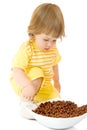 Small girl eat corn flakes Royalty Free Stock Photo