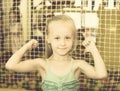 Small girl in elementary school age showing thumbs up Royalty Free Stock Photo