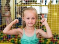 Small girl in elementary school age showing thumbs up Royalty Free Stock Photo