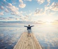 Small girl enjoying summer vacation. Happy child, sea, sky and clouds Royalty Free Stock Photo