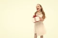 Small girl with gift box with red bow in dress. Royalty Free Stock Photo