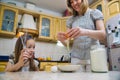 Small girl going to beat the dough for pancakes Royalty Free Stock Photo