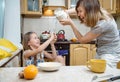 Small girl going to beat the dough for pancakes Royalty Free Stock Photo