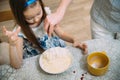 Small girl going to beat the dough for pancakes Royalty Free Stock Photo