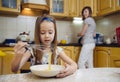 Small girl going to beat the dough for pancakes Royalty Free Stock Photo