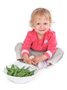 Small girl with grean peas Royalty Free Stock Photo