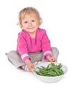 Small girl with grean peas Royalty Free Stock Photo