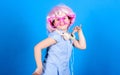 Small girl headphones pink wig dancing. Child using technology for fun. Modern headphones. Energy motion dance. Inspired