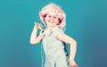 Small girl headphones pink wig dancing. Child using technology for fun. Modern headphones. Energy motion dance. Inspired Royalty Free Stock Photo