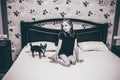 Small girl and her chihuahua in the bed Royalty Free Stock Photo