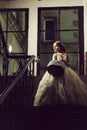 Small girl in white dress near big window Royalty Free Stock Photo