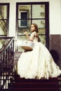 Small girl in white dress near big window Royalty Free Stock Photo