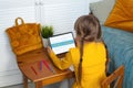 Small girl learning at home. Little child using tablet. Advance learning and Distance education concept Royalty Free Stock Photo