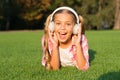 Small girl listen audio book. new technology for kids. happy childhood memories. listening to music. back to school. kid