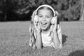 Small girl listen audio book. new technology for kids. happy childhood memories. listening to music. back to school. kid