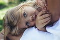 Small girl lying with mom outside Royalty Free Stock Photo