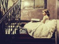 Small girl near window with basket and book Royalty Free Stock Photo