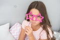 Small girl party glasses. pajama party. ready for fun. funny look of small kid. childhood moments. international