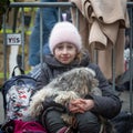 Small girl and pet dog at the Mlyny refugee centre near the Ukraine border with Poland