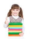 Small girl with pile books showing thumbs up. isolated on white