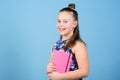 Small girl with pink note book. school child with notepad. Smart and adorable. schoolgirl ready for lesson. school Royalty Free Stock Photo