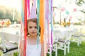 Small girl playing outdoors on garden party in summer, celebration concept. Royalty Free Stock Photo