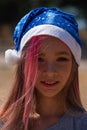 Small girl in santa hat with present have a christmas. little girl in red santa hat. Girl in santa hat Royalty Free Stock Photo