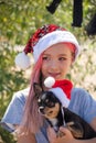 Small girl in santa hat with present have a christmas. little girl in red santa hat. Girl in santa hat Royalty Free Stock Photo