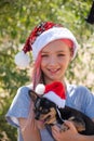 Small girl in santa hat with present have a christmas. little girl in red santa hat. Girl in santa hat Royalty Free Stock Photo