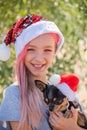 Small girl in santa hat with present have a christmas. little girl in red santa hat. Girl in santa hat Royalty Free Stock Photo