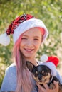 Small girl in santa hat with present have a christmas. little girl in red santa hat. Girl in santa hat Royalty Free Stock Photo