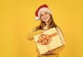 small girl santa at yellow background. xmas party celebration. happy new year. christmas shopping online. time for Royalty Free Stock Photo